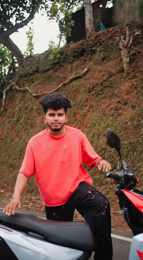 Instagram reel still from @fukru_motopsychoz for the TVS NTORQ 150 Kerala campaign