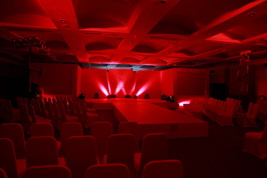 Empty runway at Dream Hotel Kochi under red lighting before Pranaah Yaama