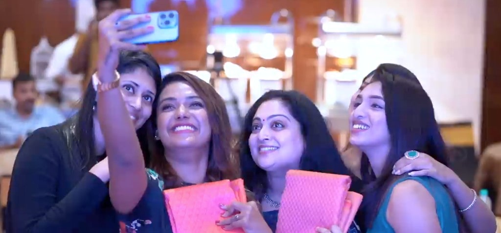 Creators taking a selfie with LuLu Celebrate fabrics at the Kochi weddingwear launch